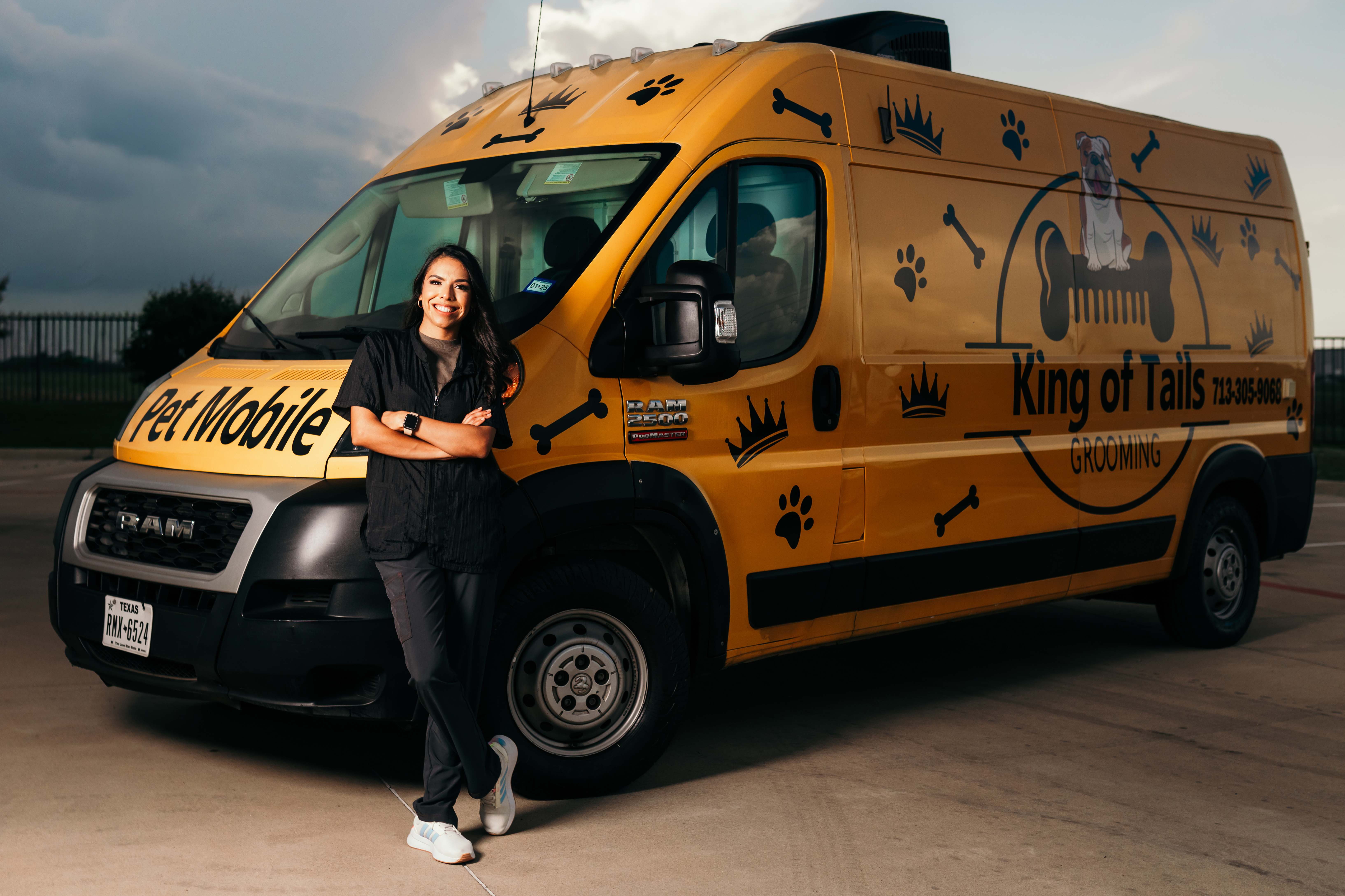 Katherine, owner of King of Tails, with the yellow mobile grooming van